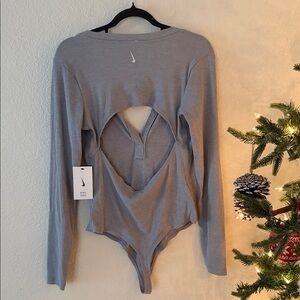 Nike yoga luxe ribbed button open back bodysuit